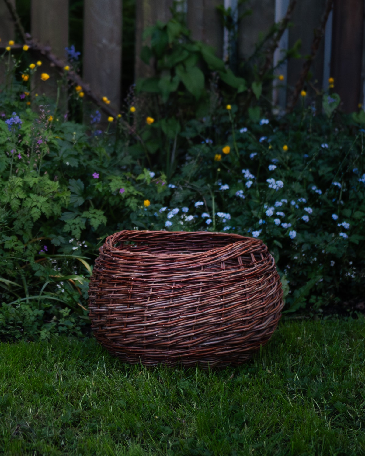 A large round willow basket with inset handles