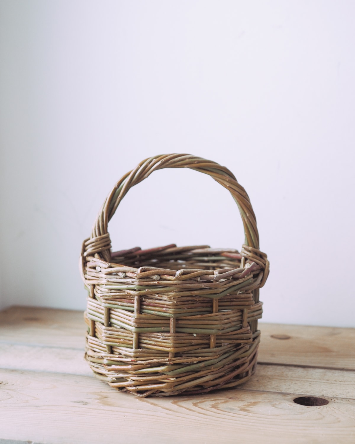 A small round willow berry basket